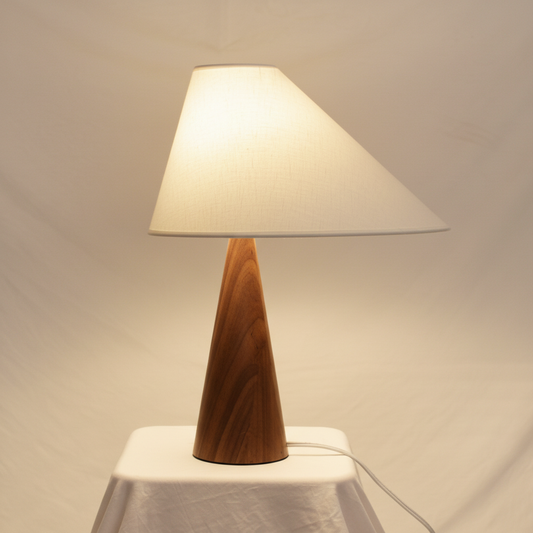 Asymmetric Drift Table Lamp – Hand-Turned Solid Wood & Linen Shade, warm white background studio shot