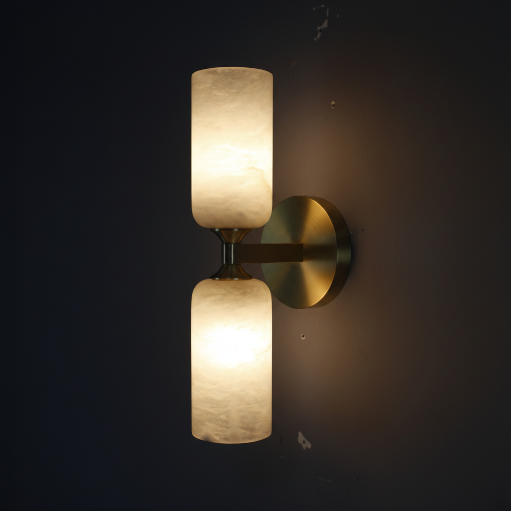 Lyra Twin Wall Sconce – Both alabaster glass globes lit with warm 2700K glow on dark charcoal background