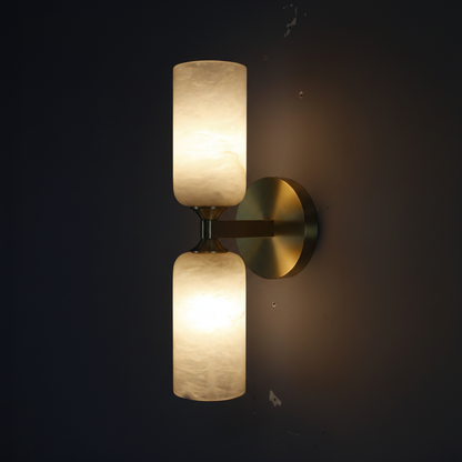 Lyra Twin Wall Sconce – Both alabaster glass globes lit with warm 2700K glow on dark charcoal background