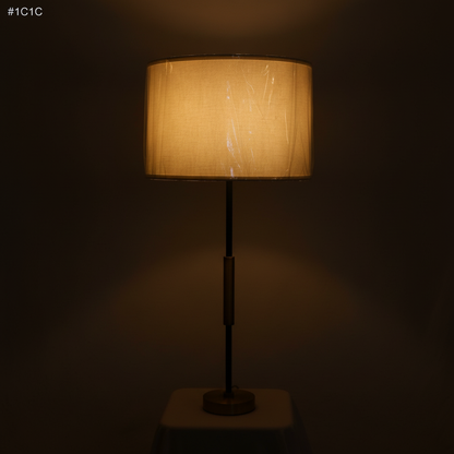 Linear Muse Table Lamp – Warm 2700K glow on dark charcoal background, brass and matte black contrast